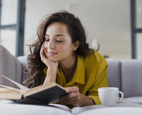 woman happily reading alone