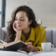 woman happily reading alone